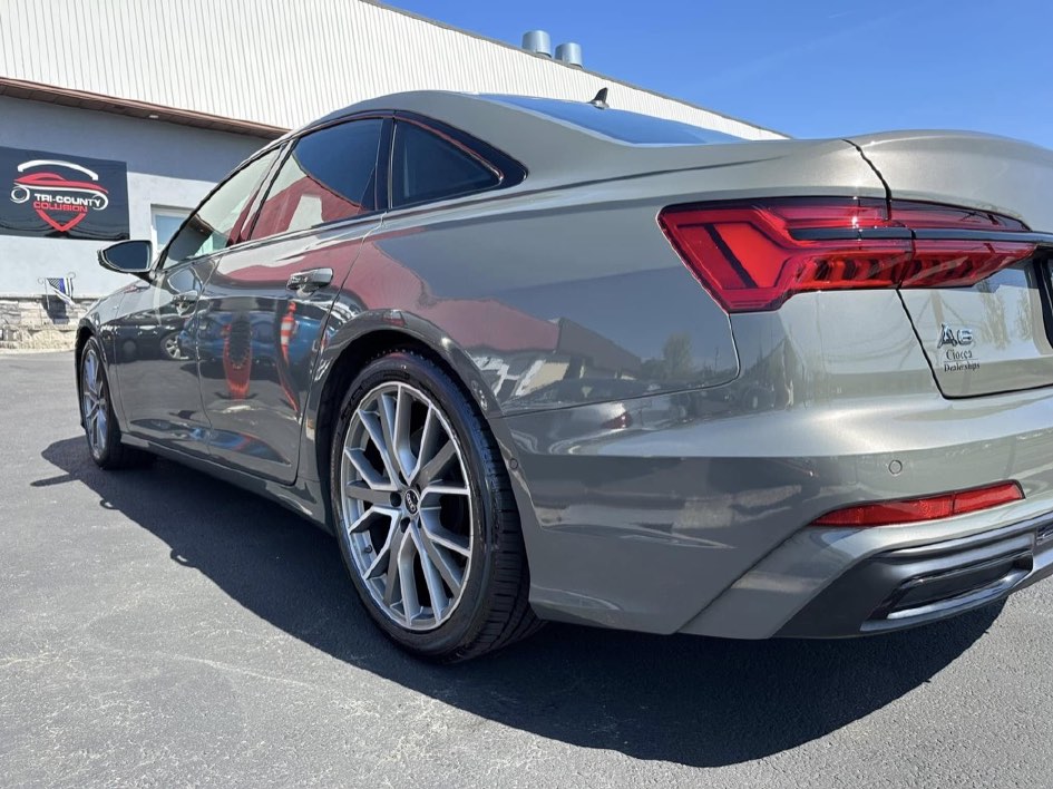 The same Audi A6 after repair, parked outside the Tri County Collision Center building.