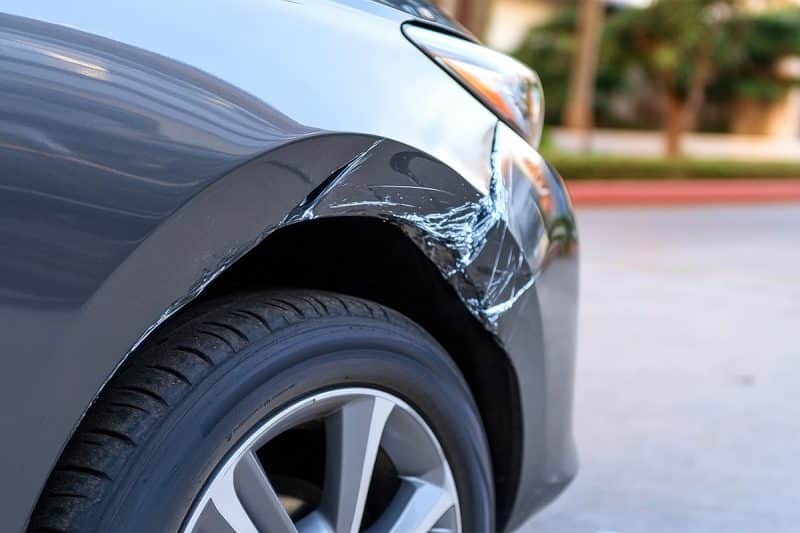 Close up of minor fender damage.